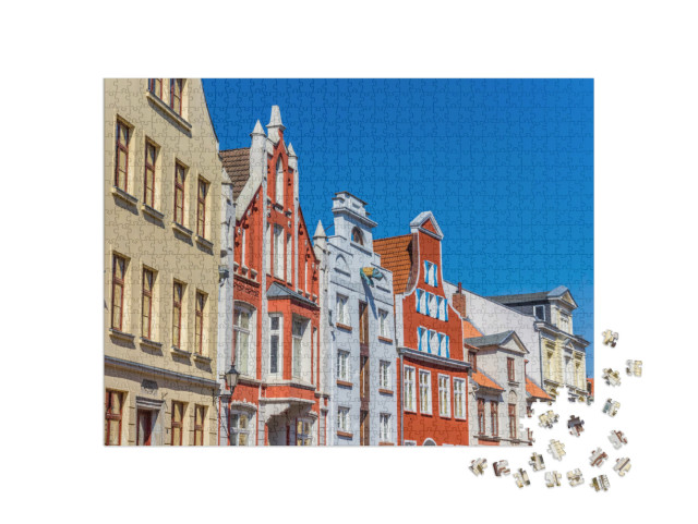 Puzzle 1000 Teile „Historische Fassaden in der Innenstadt von Wismar, Deutschland“