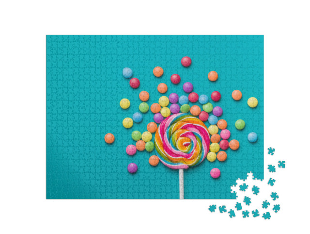Puzzle 1000 Teile „Süßer Lutscher und bunte Smarties auf blauem Hintergrund“