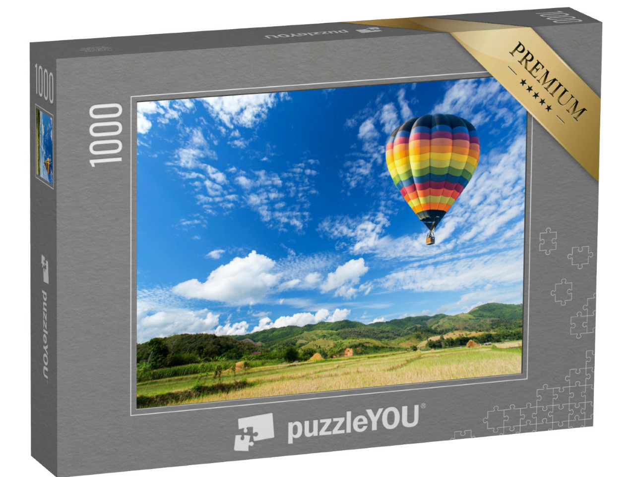 Puzzle 1000 Teile „Heißluftballon über dem Feld mit blauem Himmel“