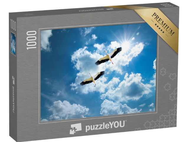 Puzzle 1000 Teile „Zwei Störche am sonnigen Himmel auf dem Weg in die Heimat“