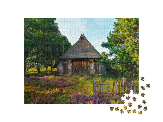 Puzzle 1000 Teile „Lüneburger Heide: Bild mit Schafshütte, Deutschland“