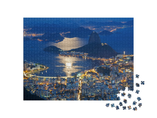 Puzzle 1000 Teile „Nachtansicht des Zuckerhuts und Botafogo in Rio de Janeiro“