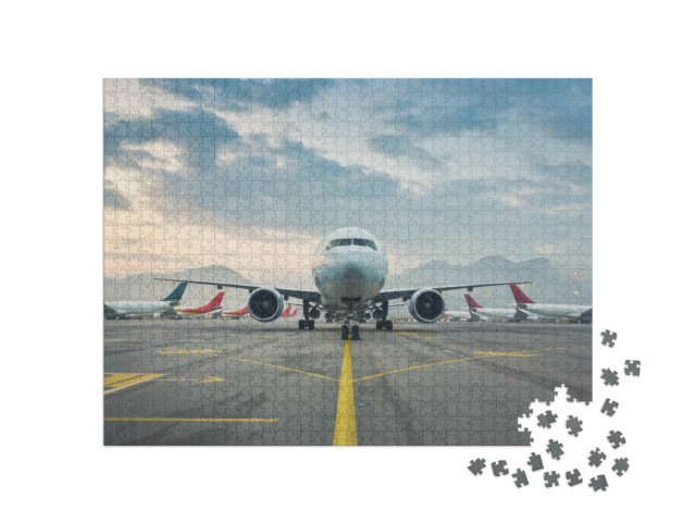 Puzzle 1000 Teile „Passagierflugzeug auf dem internationalen Flughafens Hongkong“