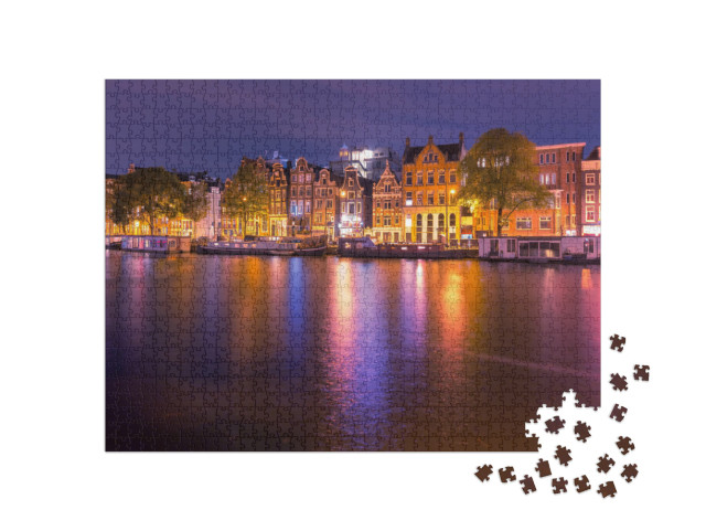 Puzzle 1000 Teile „Bezaubernder nächtlicher Kanal in Amsterdam, Niederlande.“