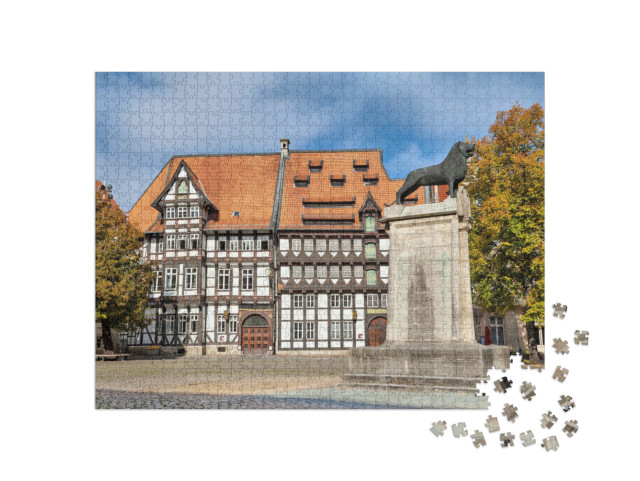Puzzle 1000 Teile „Fachwerkhaus und Löwenstatue, Burgplatz in Braunschweig, Deutschland“