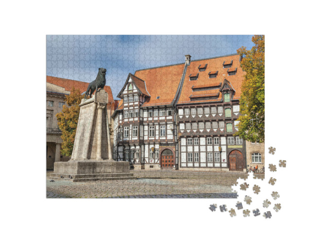 Puzzle 1000 Teile „Löwenstatue und Fachwerkhaus auf dem Burgplatz in Braunschweig“