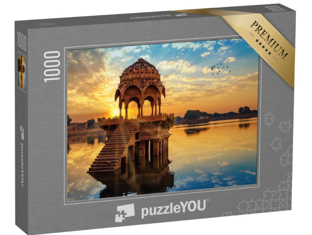 Puzzle 1000 Teile „Sonnenuntergang vor den Ruinen von Gadi Sagar, Indien“