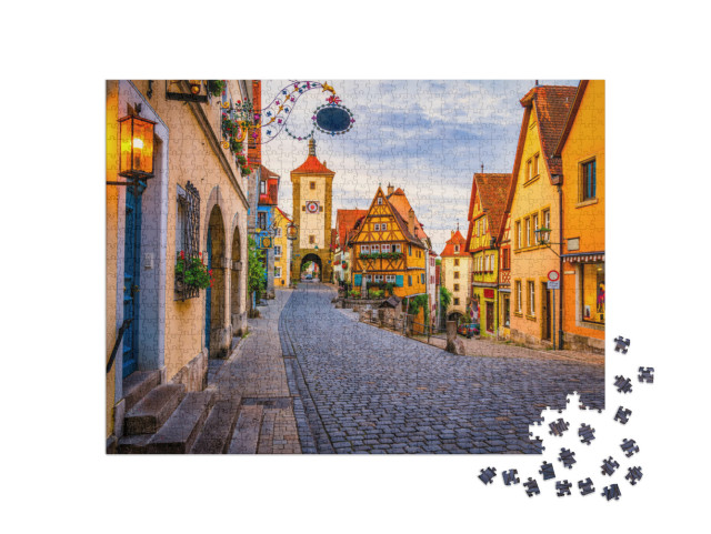 Puzzle 1000 Teile „Morgenansicht der Unteren Schmiedgasse, Rothenburg ob der Tauber, Bayern“