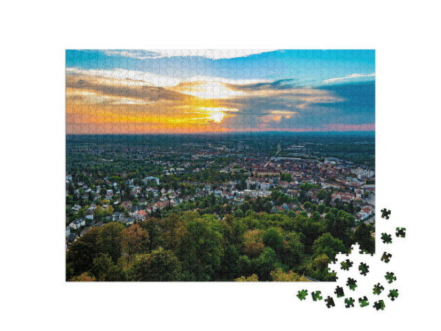 Puzzle 1000 Teile „Sturmwolken im Sonnenuntergang über Karlsruhe“
