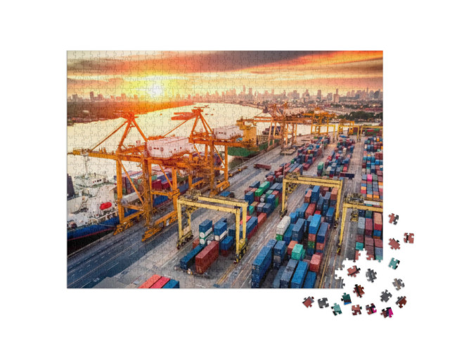 Puzzle 1000 Teile „Kranbrücken am Containerhafen bei Sonnenaufgang“