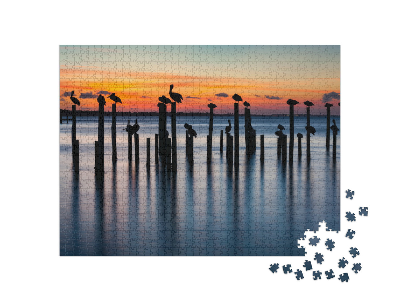 Puzzle 1000 Teile „Pelikane bei Sonnenuntergang auf alten Pfeilern“