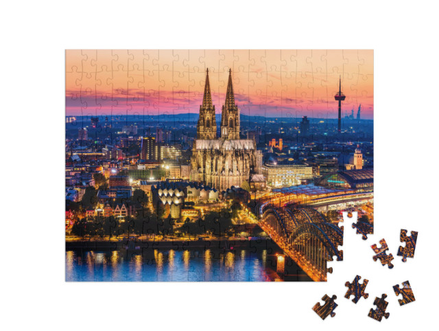 Puzzle 200 Teile „Wunderschönes Nachtpanorama des Kölner Doms, der Hohenzollernbrücke und des Rheins“