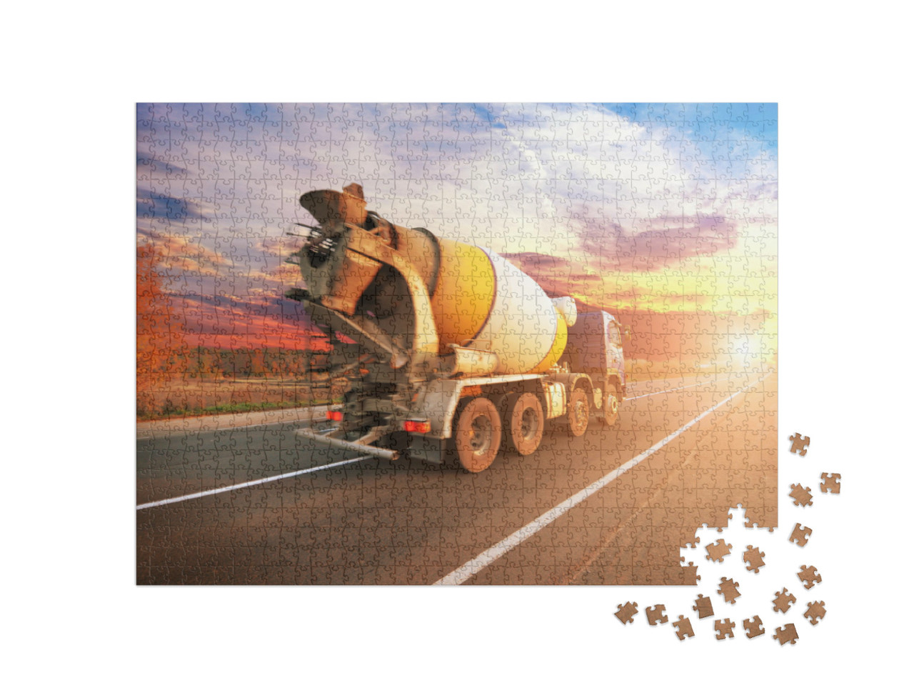 Puzzle 1000 Teile „Betonmischer auf der Straße im Sonnenuntergang“
